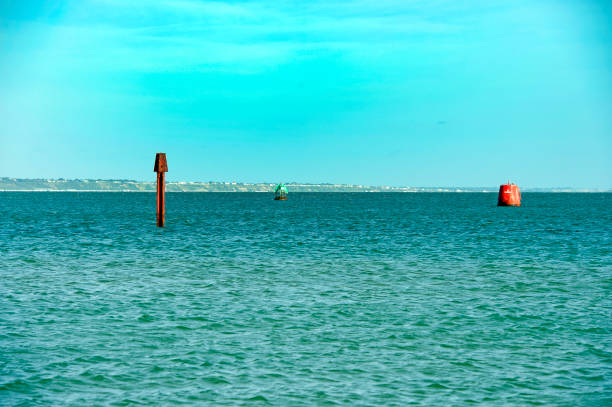 Channel marker buoys, Studland Bay, Jurassic Coast, Dorset, England, UK. Channel marker buoys. Predominantly a recreation and tourist area,, Poole Bay has historically been significant strategically in WW2 as well as being of special scientific interest with its nature reserve areas and Jurassic coast coastline around Studland Bay, Jurassic Coast, Dorset, England, UK. channel marker stock pictures, royalty-free photos & images