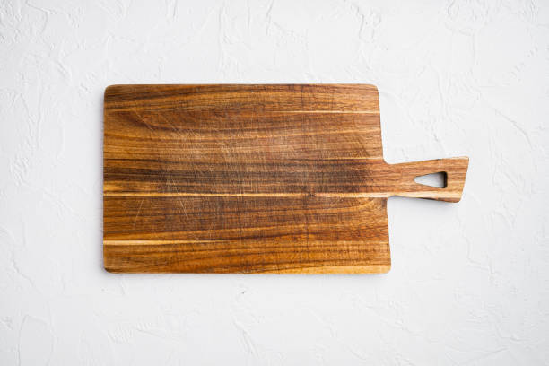 istock Bamboo cutting board empty for empty for copy space for text or food, top view flat lay , on white stone table background 1352419927
