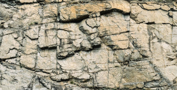 istock Rough texture of natural stone, granite rock 1352419983