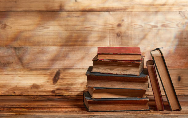 istock Vintage books on wood 1352420357