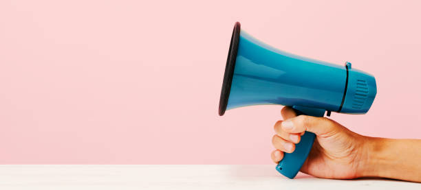 istock man has a megaphone in his hand, web banner 1352422789