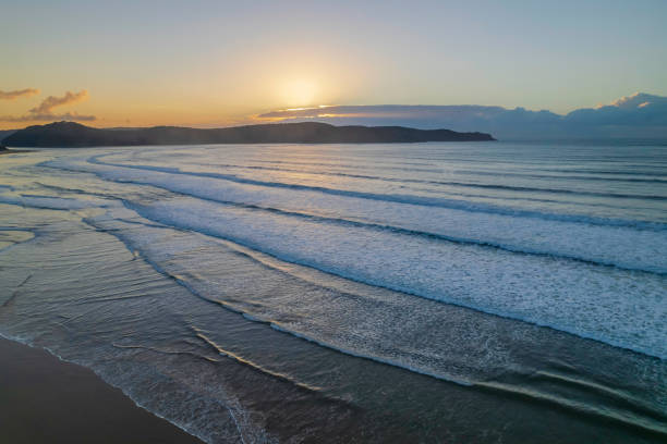 istock Aerial sunrise seascape with low cloud bank 1352422874