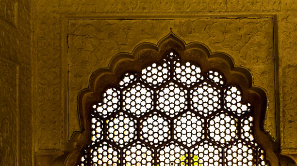 istock Light coming through the stone lattice window 1352424801