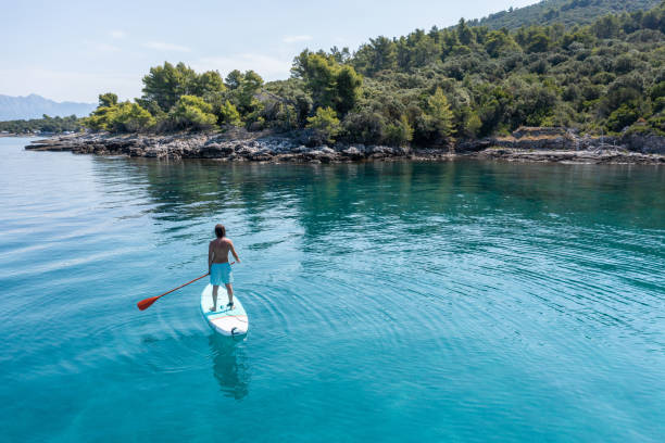 istock Drone view of man on a stand up paddle in Croatia 1352426111