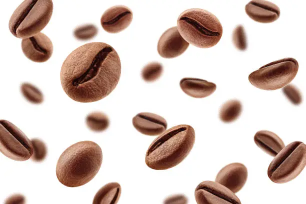 Photo of Falling coffee beans isolated on white background, selective focus