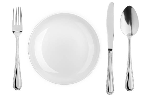 istock Empty plate, fork, knife, spoon, cutlery isolated on white background, clipping path, top view 1352426193