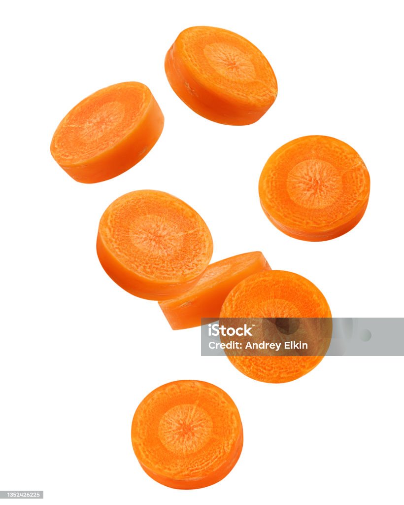 Falling Carrot slice isolated on white background, clipping path, full depth of field Carrot Stock Photo