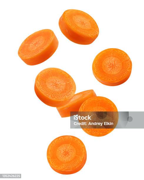 Falling Carrot Slice Isolated On White Background Clipping Path Full Depth Of Field Stock Photo - Download Image Now