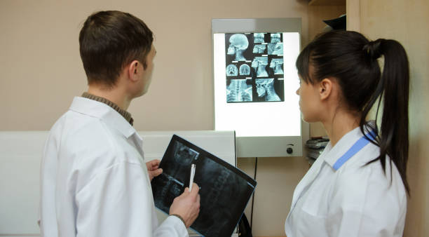istock a man and a woman exploring cervical region x-ray 1352427191