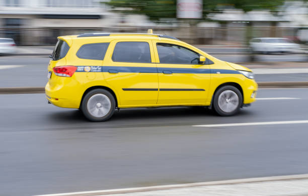 Moving taxi in Copacabana avenue stock photo