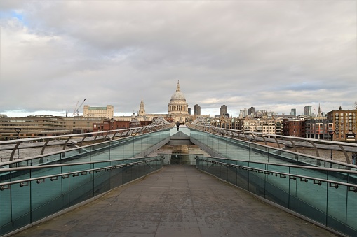 London, UK - November 18 2020: Empty and deserted Millennium Bridge during the coronavirus lockdown, with St Paul's Cathedral in the background.