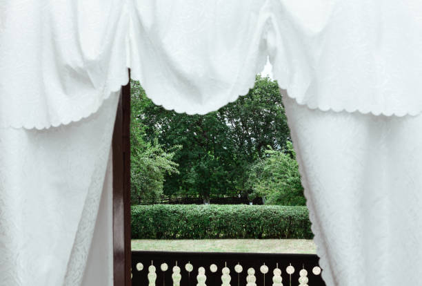 istock White Cotton Curtains at balcony 1352431295
