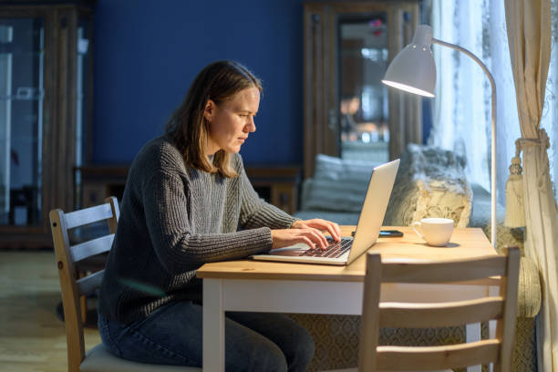 istock Woman working on laptop at home 1352431995