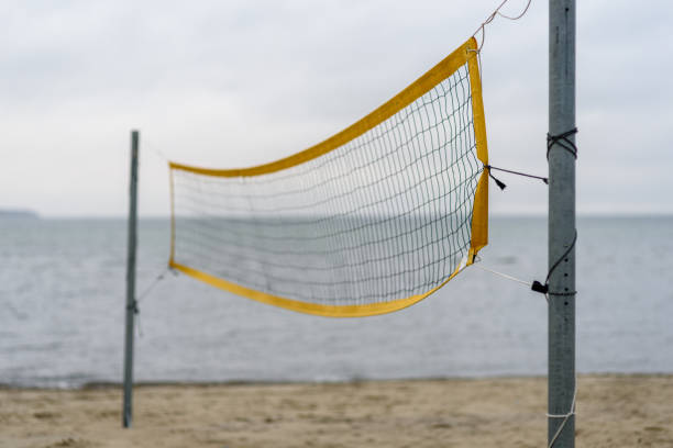 istock Volleyball net on beach near sea 1352433342