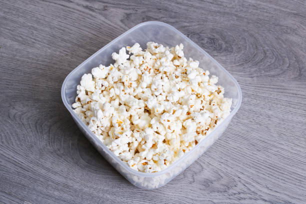 istock Popcorn in a bowl on a wooden table 1352433675