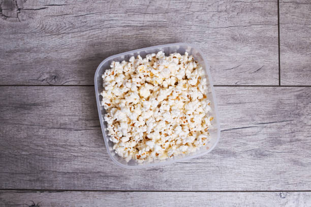istock Popcorn in a bowl on a wooden table 1352433678