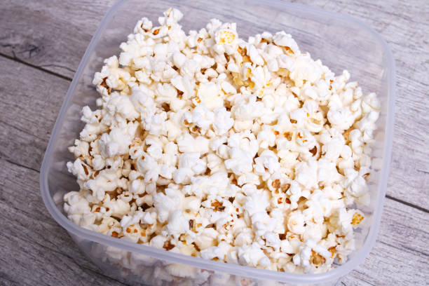 istock Popcorn in a bowl on a wooden table 1352433716