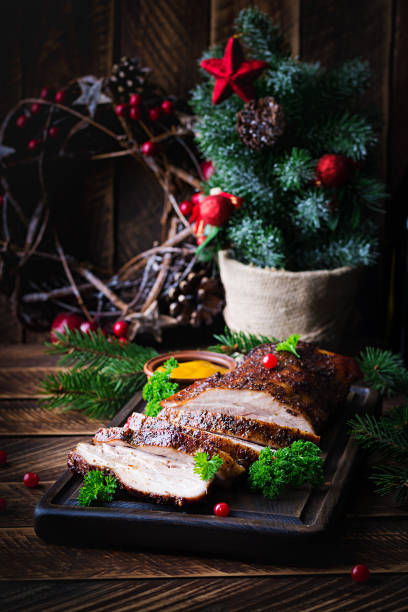 istock Baked pork belly with herbs. Boiled pork. Festive Christmas table. 1352433784