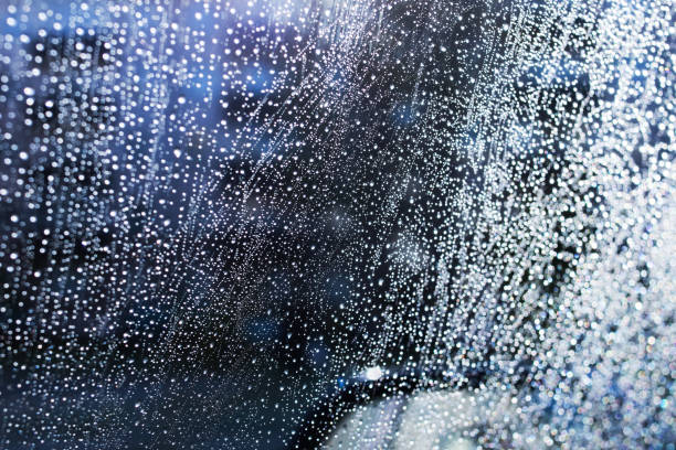 istock Raindrops on glass in light of sun 1352433891