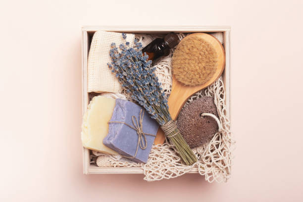 istock Wooden box with reusable cosmetic accessories on a pink background 1352434009