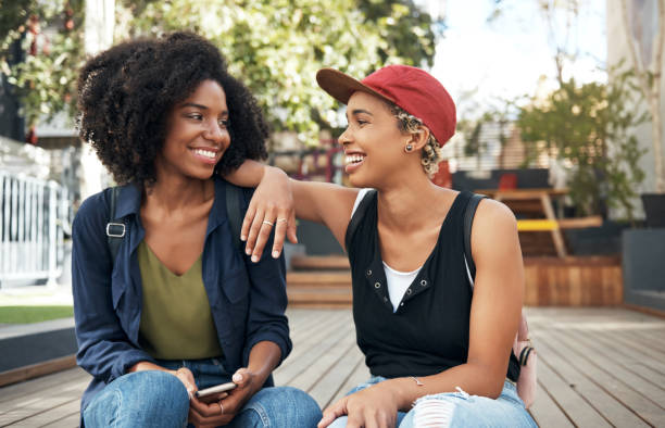 Shot of two young friends having an interesting conversation outside Like flirting with kerosene lesbian stock pictures, royalty-free photos & images