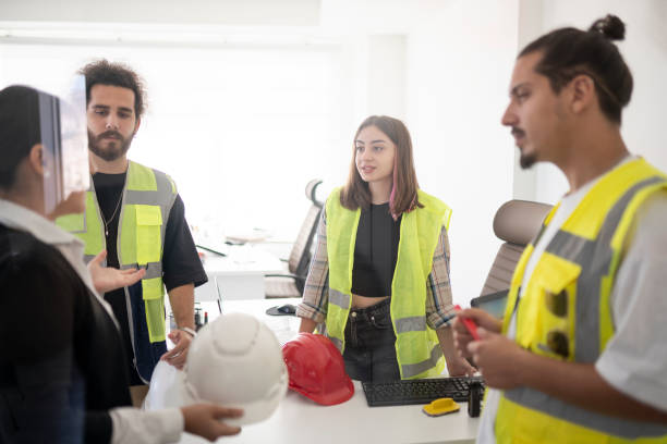 istock Architects talking about a new project in the office 1352437929