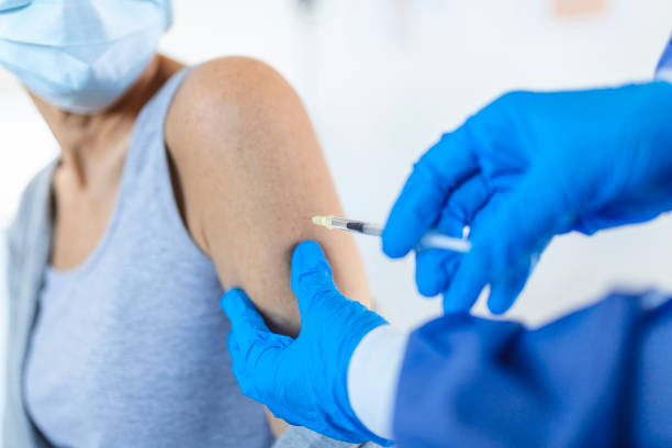 istock Covid-19 Vaccination. Senior Patient Getting Vaccinated Against Coronavirus Receiving Covid Vaccine Intramuscular Injection During Doctor's Appointment In Hospital. Corona Virus Immunization 1352438295