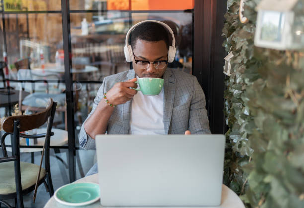 istock Male Freelancer At Coffee Shop 1352438433