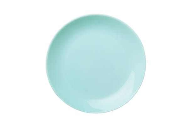 istock Blue ceramic round plate isolated over white background. Top view 1352439739