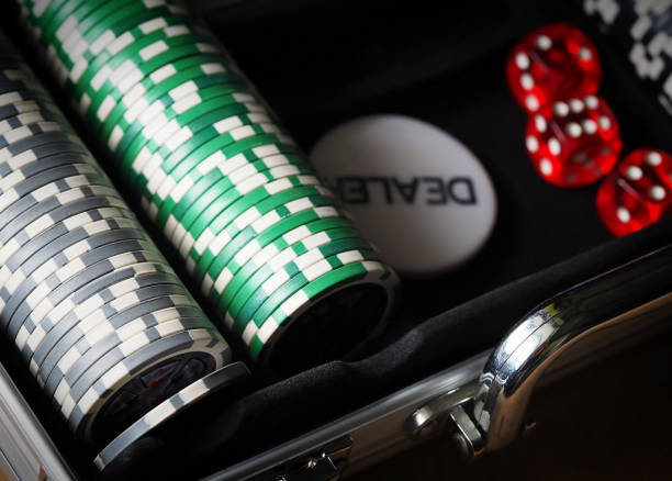 istock red playing dice, poker plastic chips, close-up 1352441270