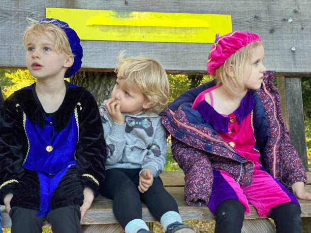 istock Children waiting on a bench 1352441435