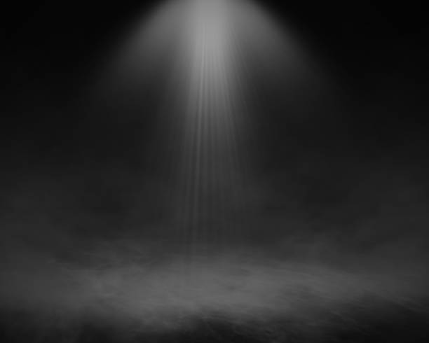 istock 3D misty room interior with spotlight shining down 1352445347