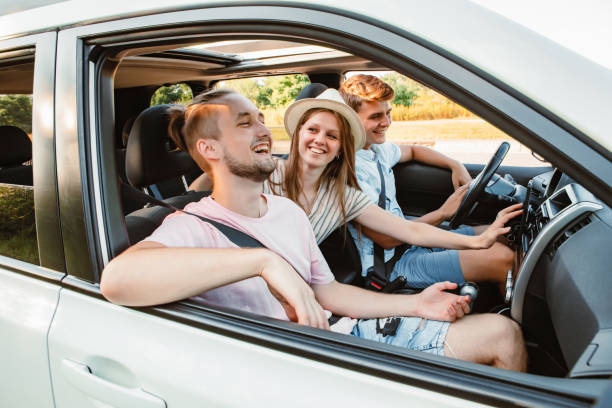 istock four friends in car navigation on phone 1352445361