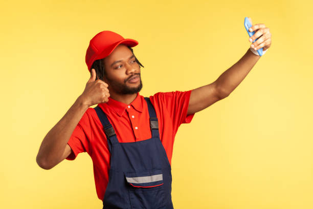 istock Worker having video call with client, showing thumb up, talking about perfect job, execute order. 1352445799