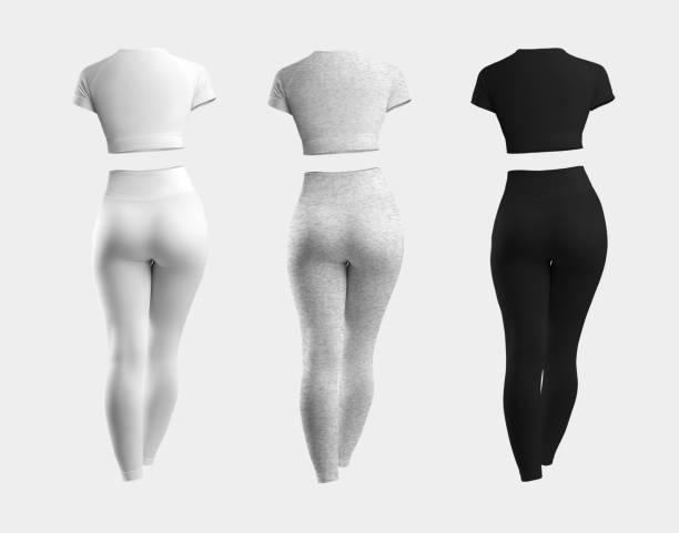 istock Mockup of white, heather, black compression suit, 3D rendering, crop top, leggings, isolated on background. Set back view 1352445856
