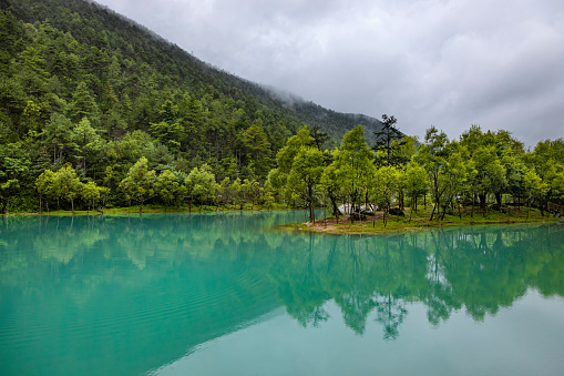 Emerald green coloured lake in Blue Moon Valley near Jade Dragon Snow Mountain, Lijiang City, Yunnan province, China