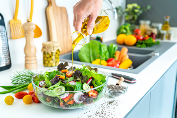 istock Dressing salad with olive oil 1352447172