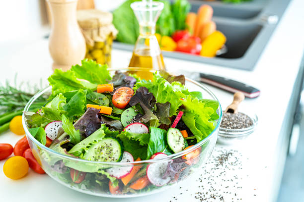 Fresh salad bowl on kitchen counter