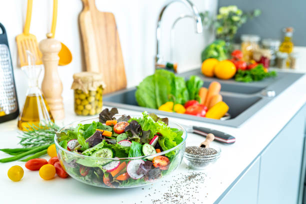 istock Healthy salad bowl on kitchen counter 1352447202
