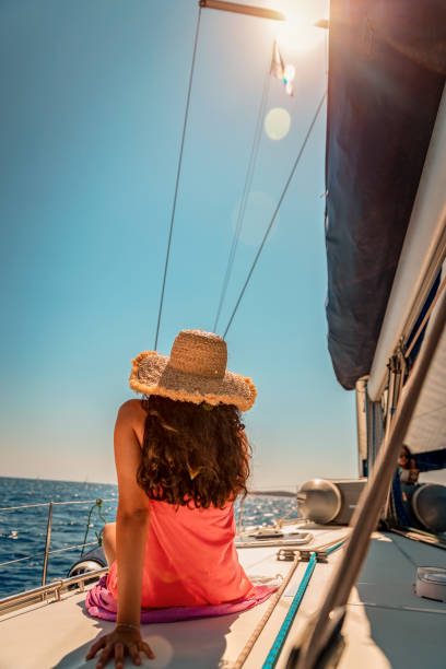 istock Woman Tanning on Sailboat 1352447788