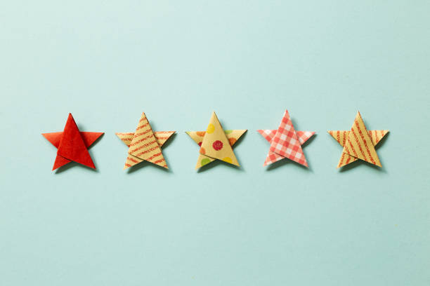 istock Five stars quality rating on blue background. top view 1352447903
