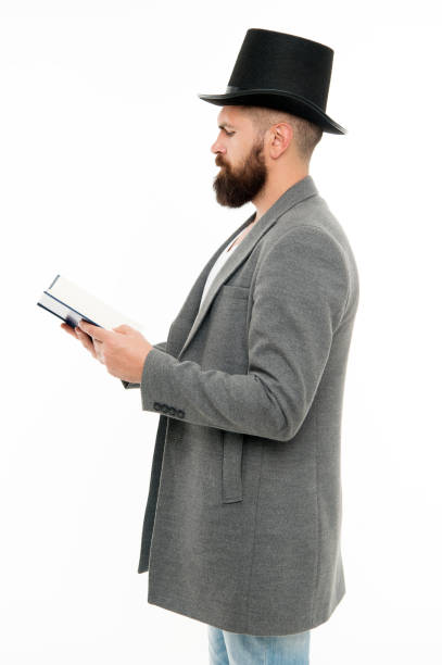 istock Dig into reading. Bearded man read book isolated on white. Poetry reading. Home reading and schooling. Bibliophile in top hat. School and education. Reading makes you more creative 1352448830