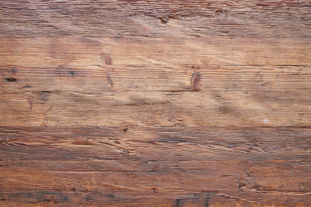 istock Textured walnut wooden table view from above 1352451417