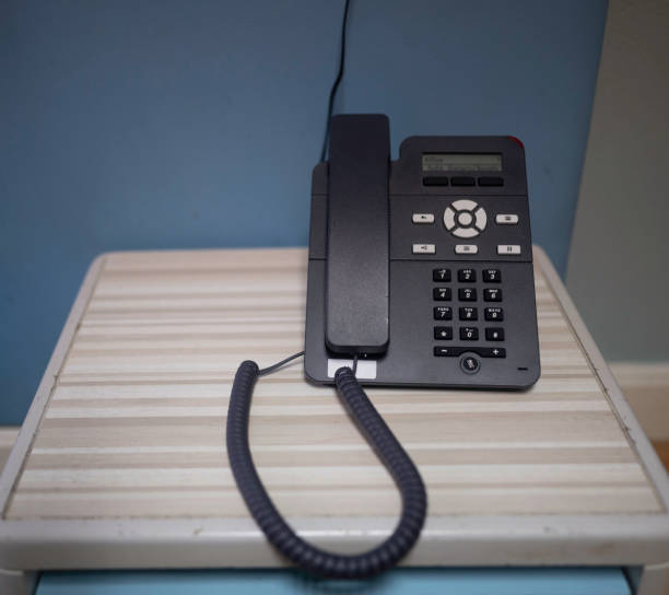 istock corded black office desk phone 1352462208