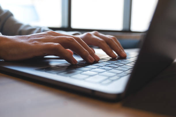 istock a woman working and typing on laptop computer keyboard on the table 1352463905