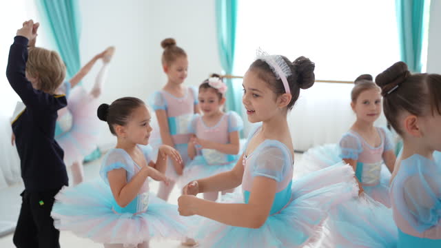 Little ballet troupe practicing pirouette