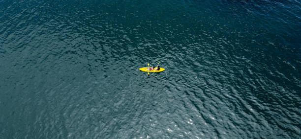 istock Drone view of couple using kayak during recreation time during vacation 1352466009