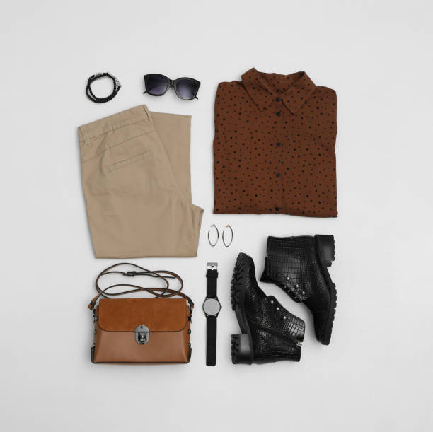 Set with ankle boots, stylish clothes and accessories on white background, top view