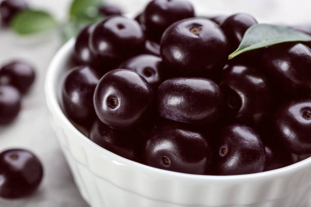 istock Fresh acai berries in bowl, closeup view 1352472506