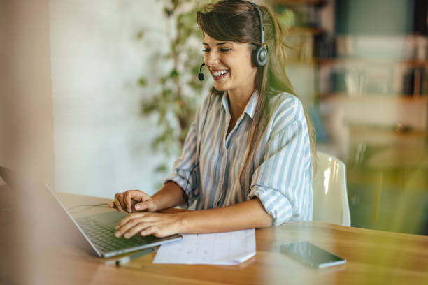 istock Friendly young woman, helping her customers, online 1352473193